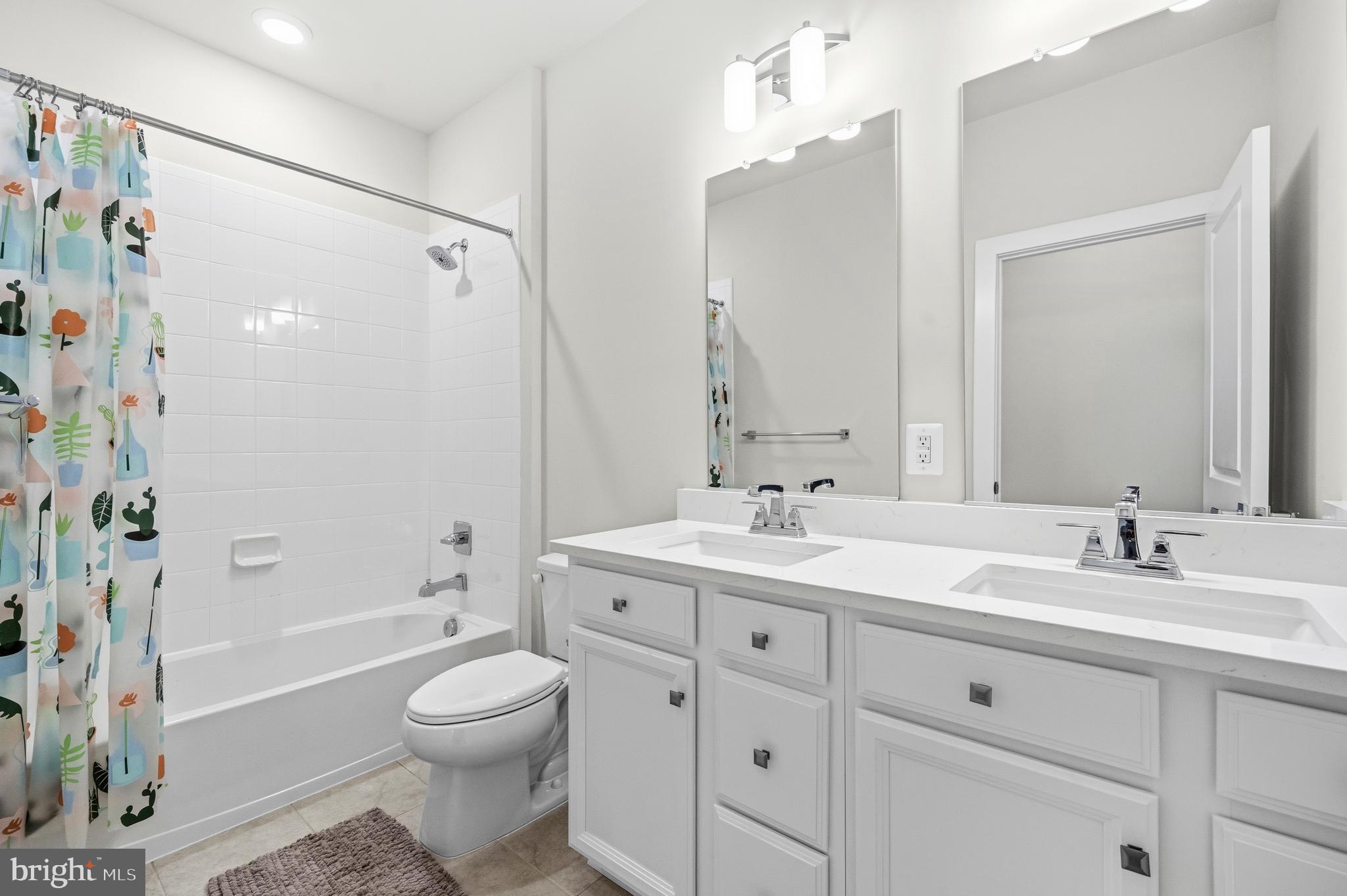 103 Brown Branch Road Laurel, MD 20708 - Photo 25 of 35 a bathroom with a toilet a sink a mirror a bathtub and vanity