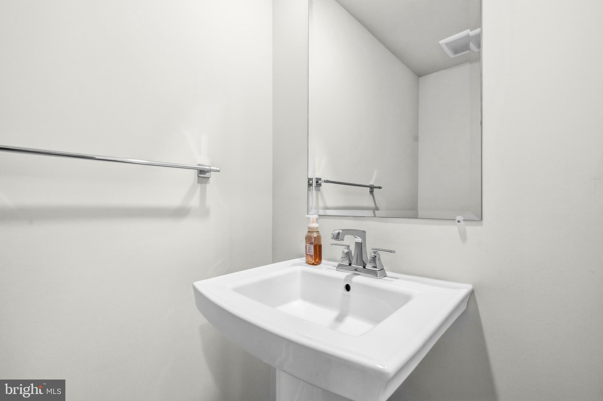 103 Brown Branch Road Laurel, MD 20708 - Photo 28 of 35 a bathroom with a sink and a mirror