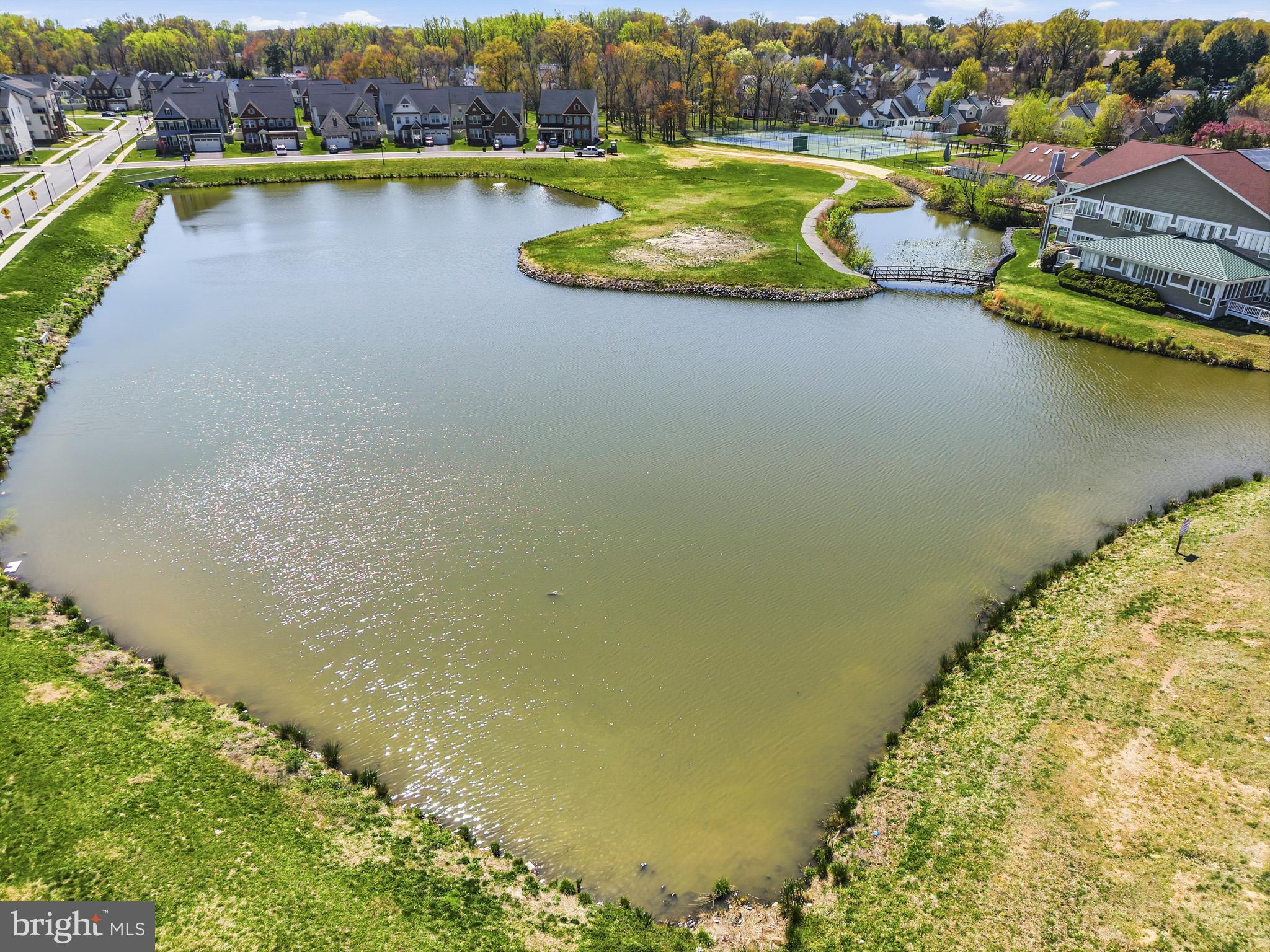 103 Brown Branch Road Laurel, MD 20708 - Photo 34 of 35 an aerial view of a house with a swimming pool and lake view
