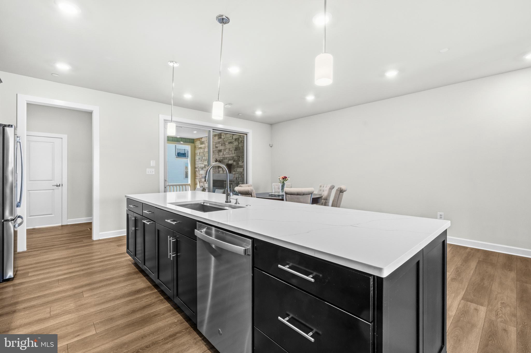 103 Brown Branch Road Laurel, MD 20708 - Photo 7 of 35 a kitchen with a sink and wooden floor