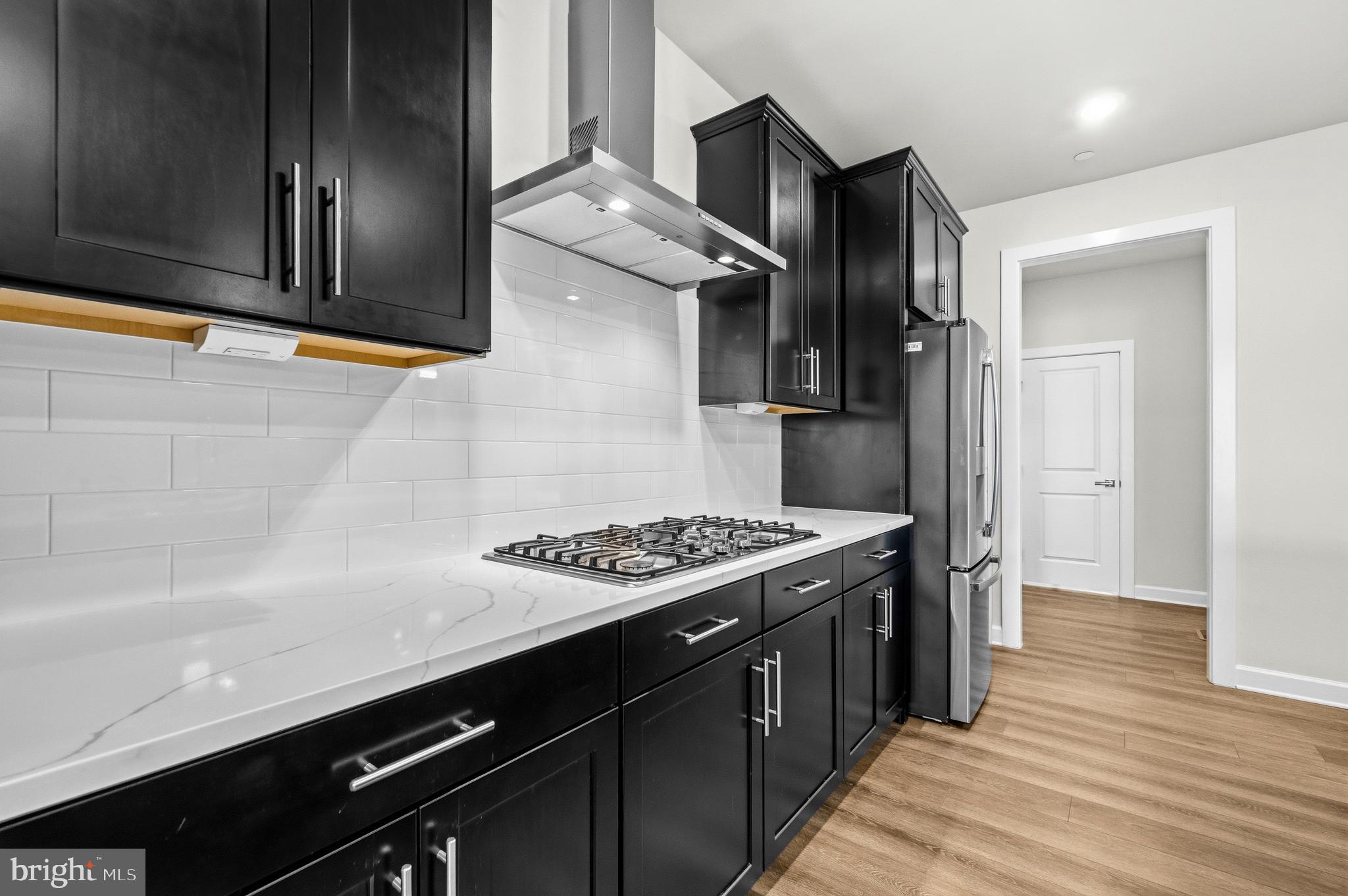 103 Brown Branch Road Laurel, MD 20708 - Photo 8 of 35 a kitchen with stainless steel appliances granite countertop a stove and a refrigerator