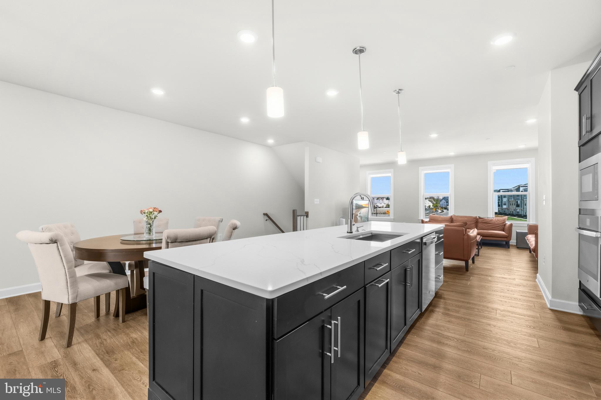 103 Brown Branch Road Laurel, MD 20708 - Photo 10 of 35 a large kitchen with a table and chairs