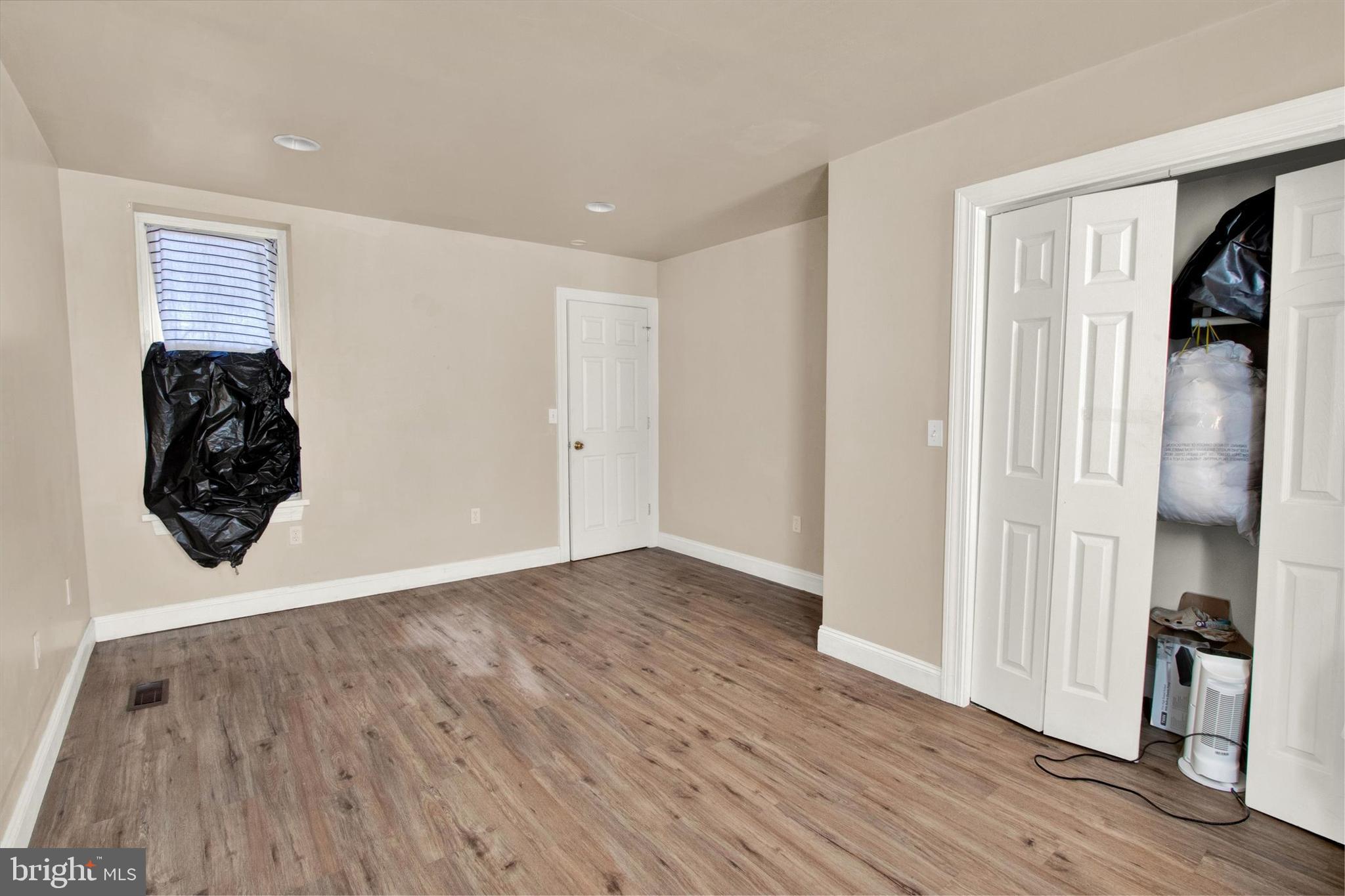 531 Chestnut Street, Unit 2 Reading, PA 19602 - Photo 6 of 8 a view of a room with wooden floor and closet