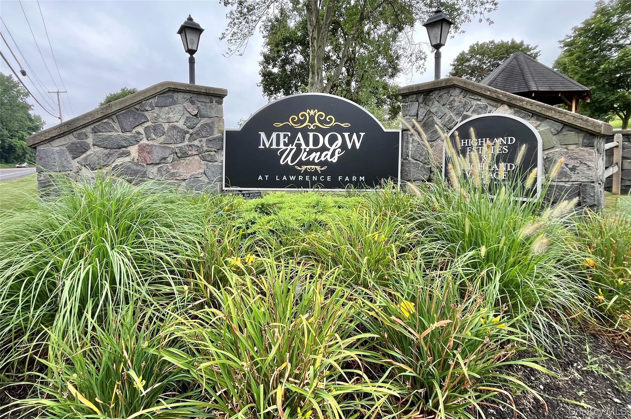 1064 Maggie Road, Unit 135 Newburgh, NY 12550 - Photo 1 of 1 a front view of a house with garden