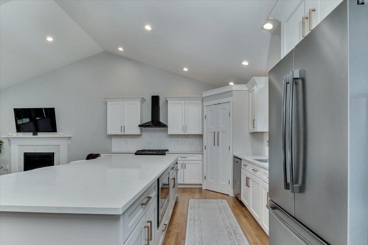 14 Valley Brook Road Centerville, MA 02632 - Photo 13 of 47 a kitchen with stainless steel appliances a refrigerator stove microwave and sink