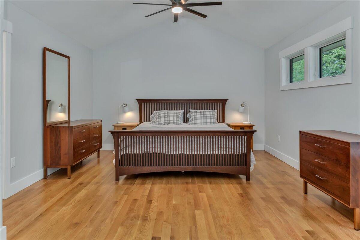 14 Valley Brook Road Centerville, MA 02632 - Photo 19 of 47 a bedroom with a bed and wooden floor