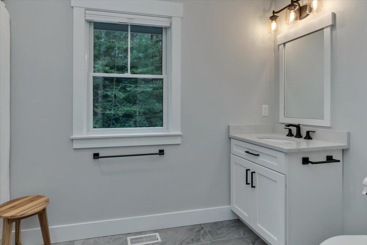 14 Valley Brook Road Centerville, MA 02632 - Photo 26 of 47 a bathroom with a sink and a mirror