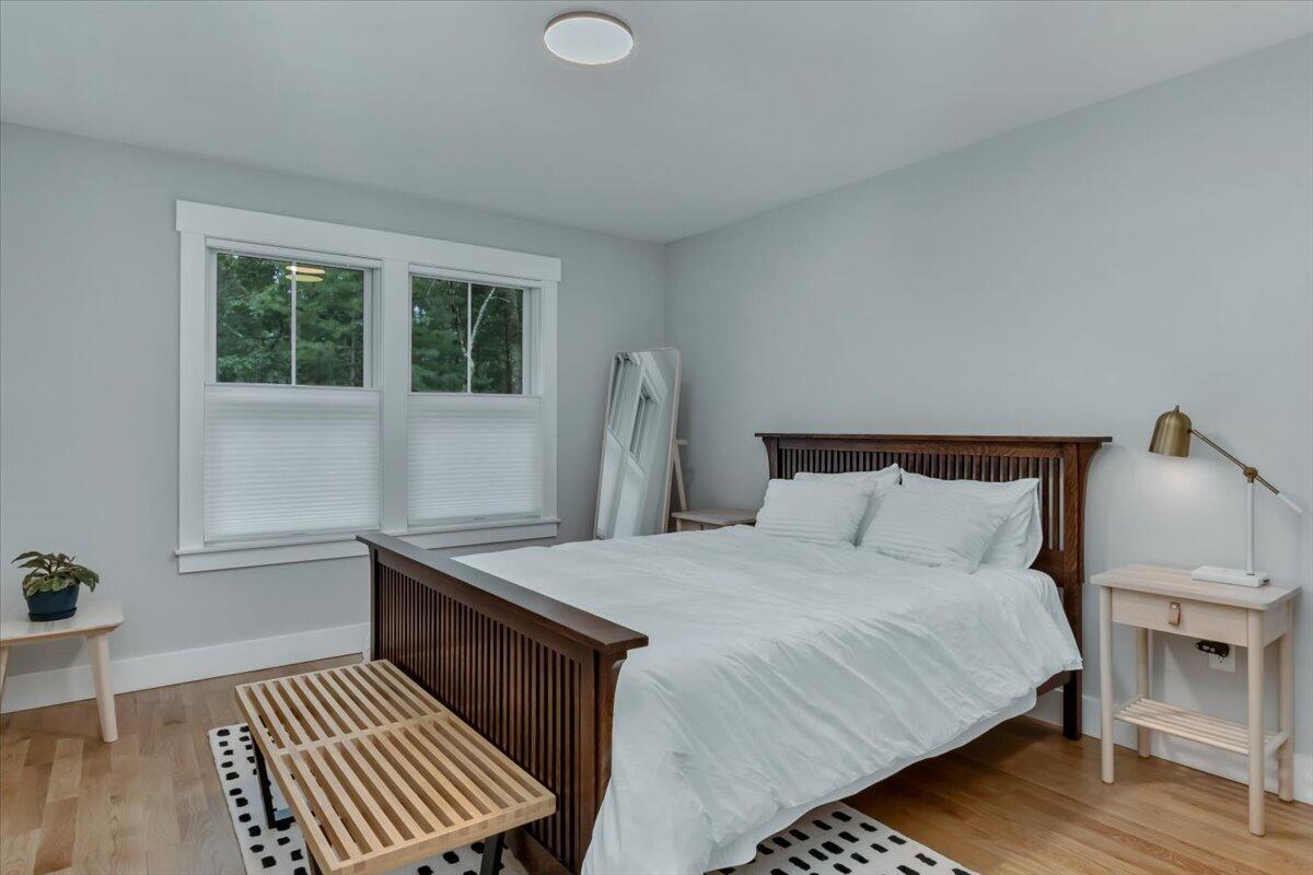 14 Valley Brook Road Centerville, MA 02632 - Photo 27 of 47 a bedroom with a bed and wooden floor
