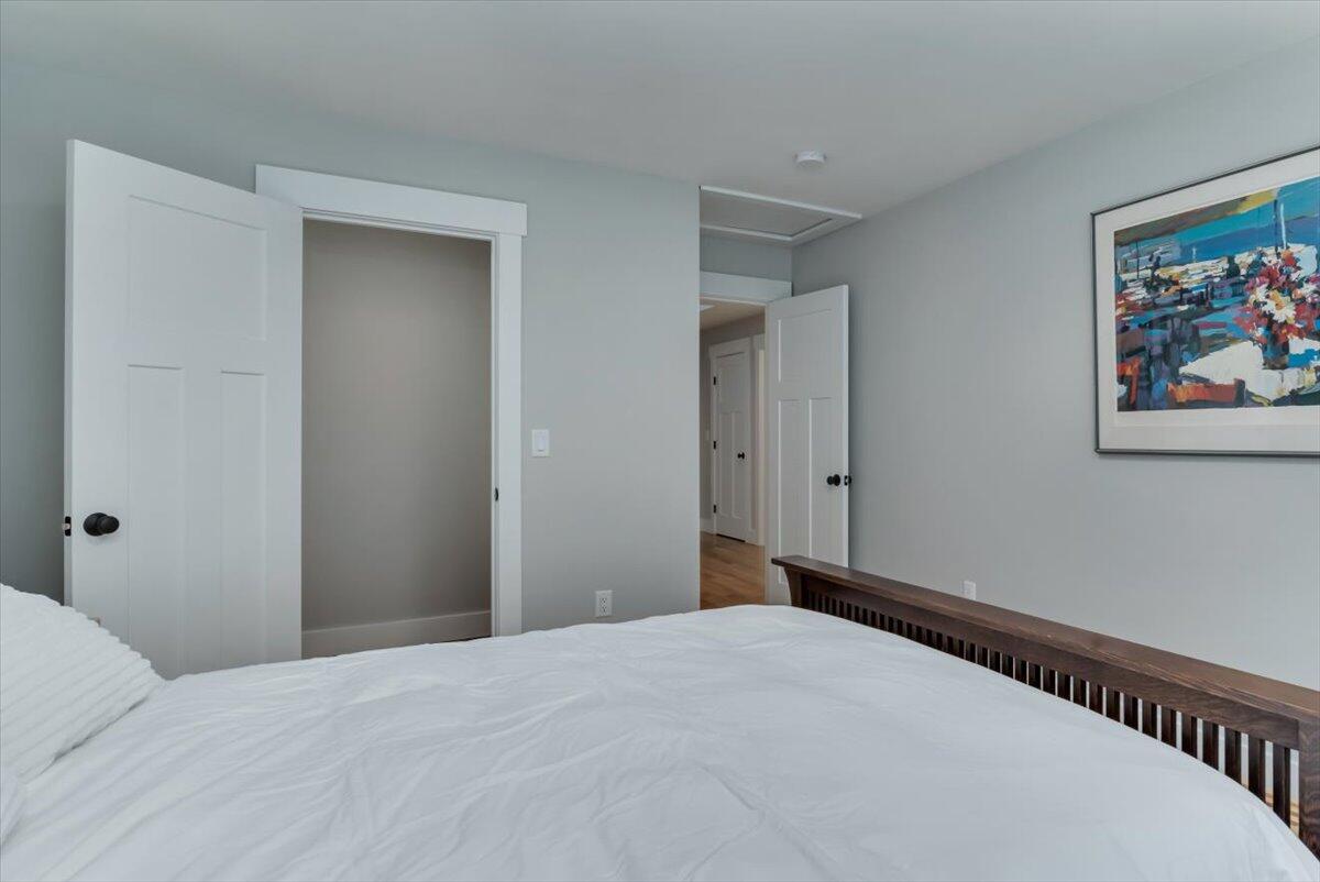 14 Valley Brook Road Centerville, MA 02632 - Photo 29 of 47 a bedroom with a bed and painting on the wall