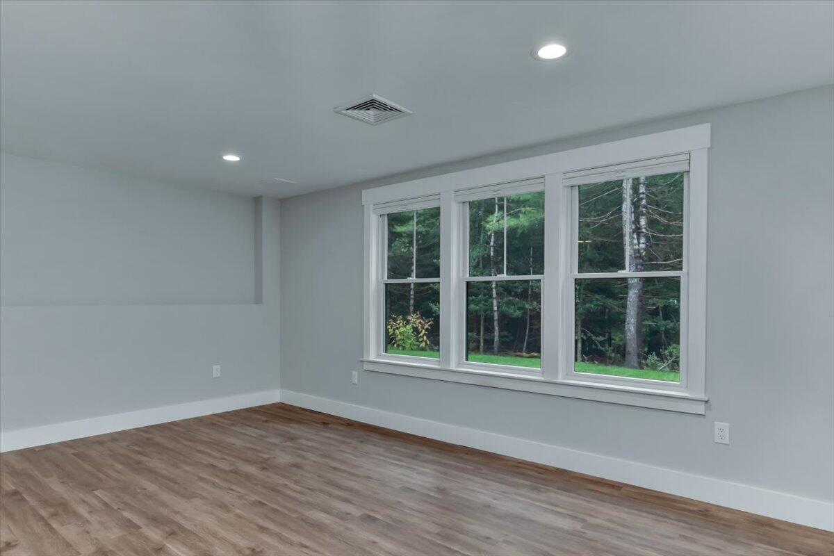14 Valley Brook Road Centerville, MA 02632 - Photo 35 of 47 a view of an empty room with wooden floor and a window