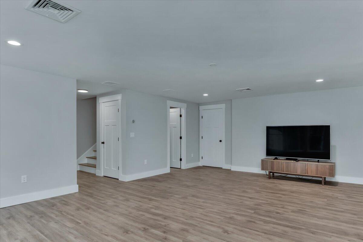14 Valley Brook Road Centerville, MA 02632 - Photo 36 of 47 a room with wooden floor and flat screen tv