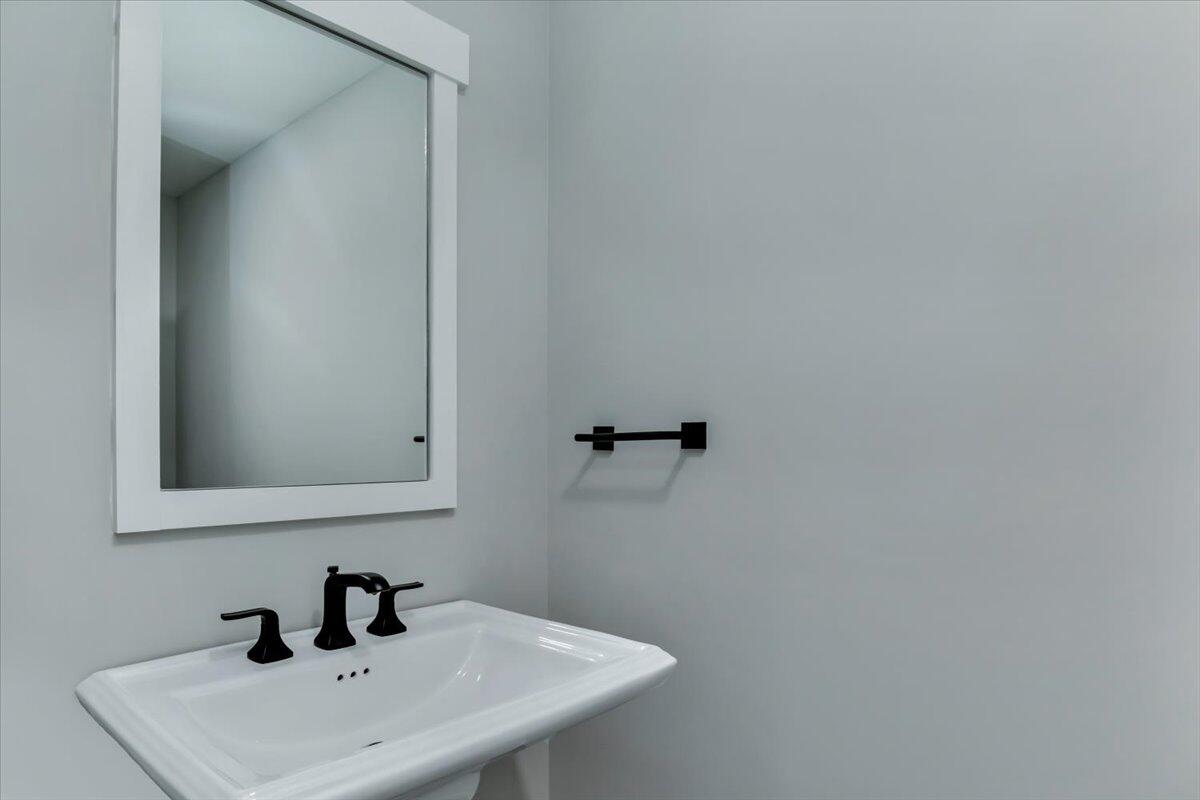 14 Valley Brook Road Centerville, MA 02632 - Photo 38 of 47 a bathroom with a sink and mirror