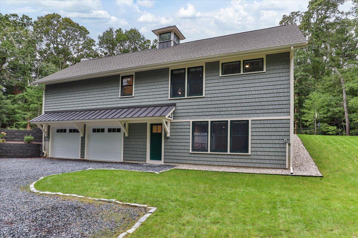 14 Valley Brook Road Centerville, MA 02632 - Photo 40 of 47 a front view of a house with a garden