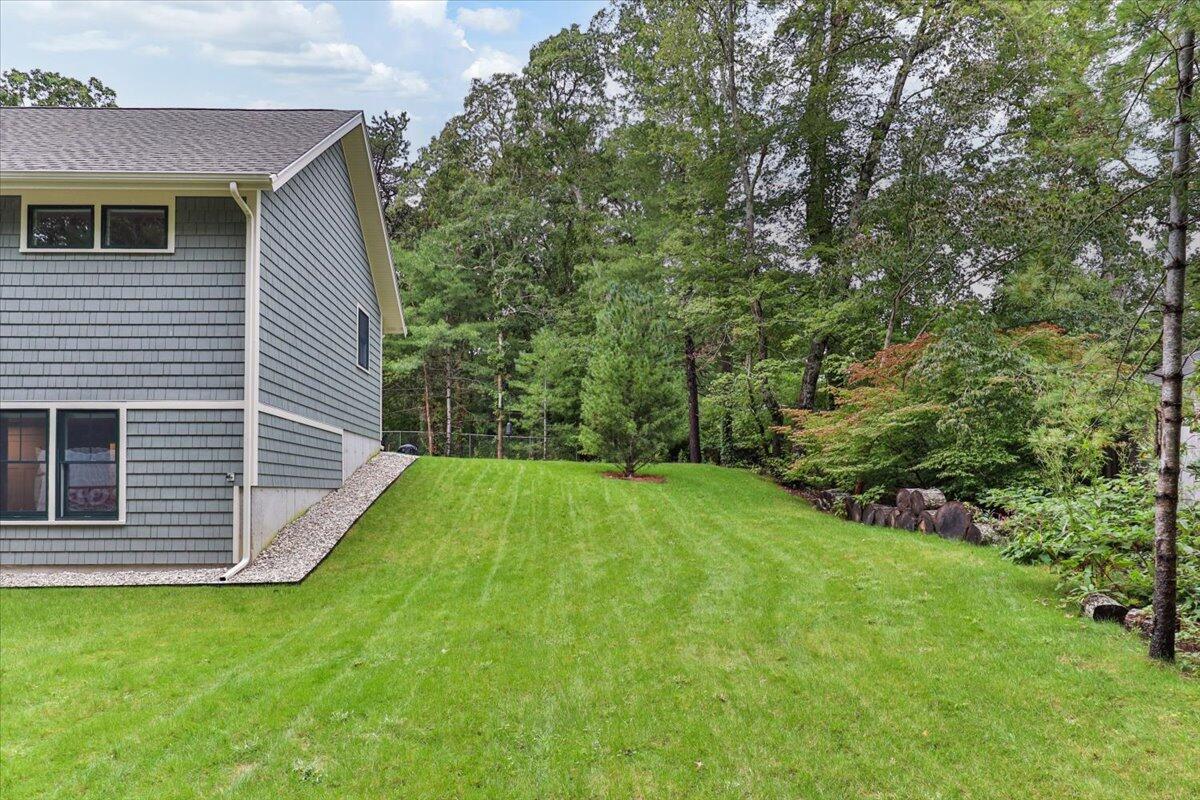 14 Valley Brook Road Centerville, MA 02632 - Photo 41 of 47 a view of a backyard with a small cabin