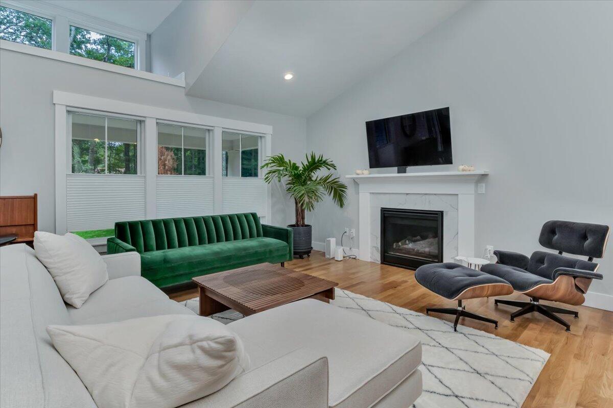 14 Valley Brook Road Centerville, MA 02632 - Photo 7 of 47 a living room with furniture fireplace and flat screen tv
