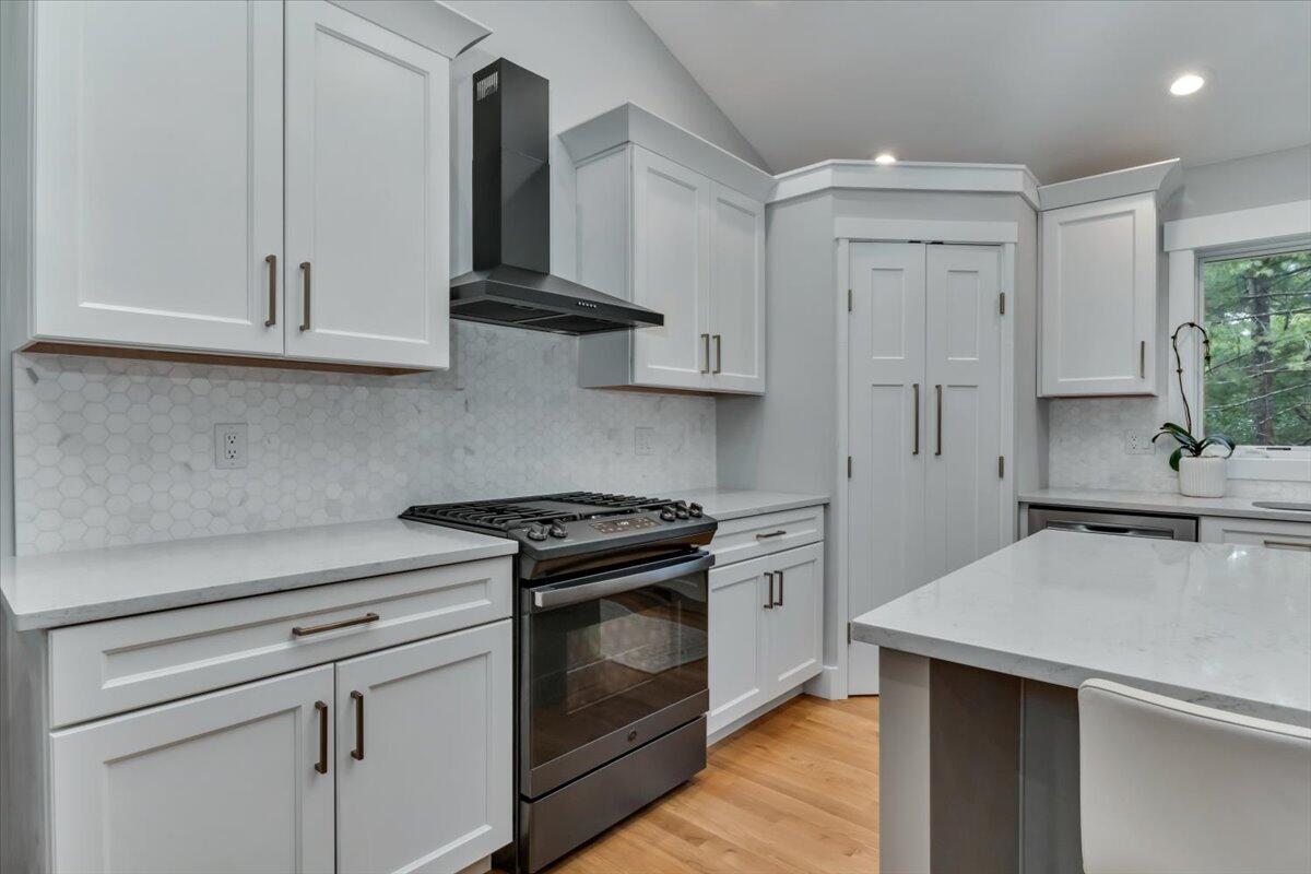 14 Valley Brook Road Centerville, MA 02632 - Photo 10 of 47 a kitchen with white cabinets and white appliances