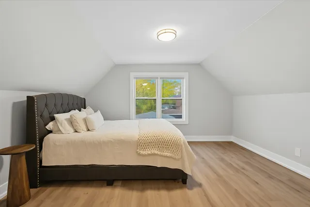 a bedroom with a bed and window