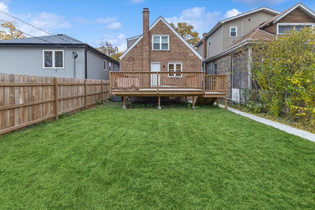 8404 South Carpenter Street Chicago, IL 60620 - Photo 18 of 21 a view of backyard with a garden and deck