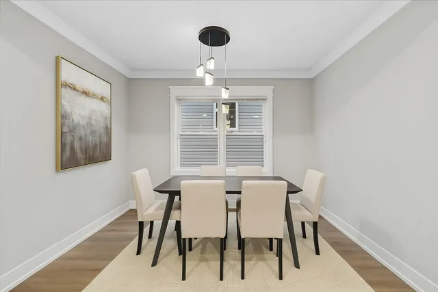 a view of a dining room with furniture and windows