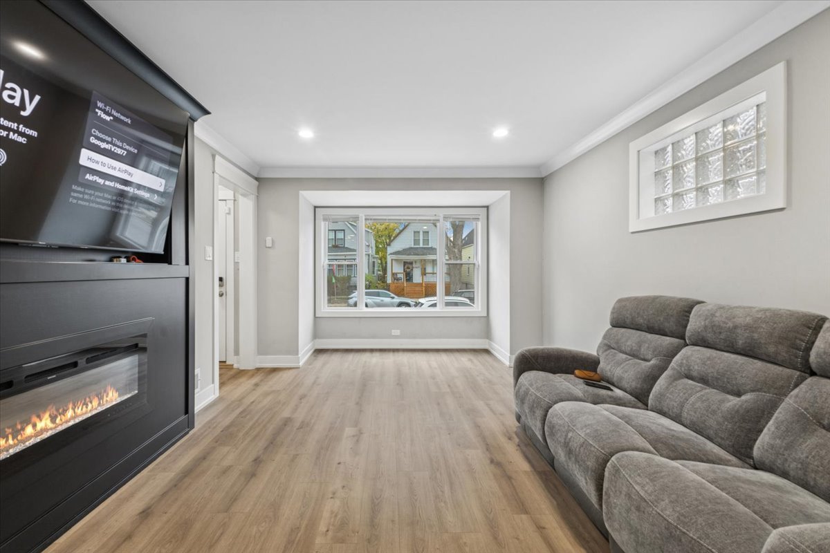 8404 South Carpenter Street Chicago, IL 60620 - Photo 5 of 21 a living room with furniture and a fireplace