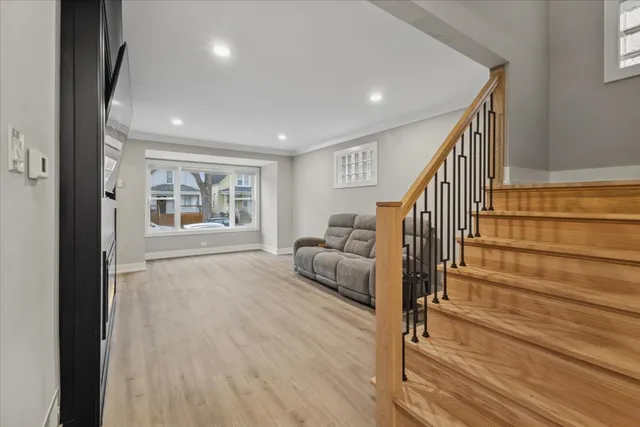 a livingroom with furniture wooden floor and windows