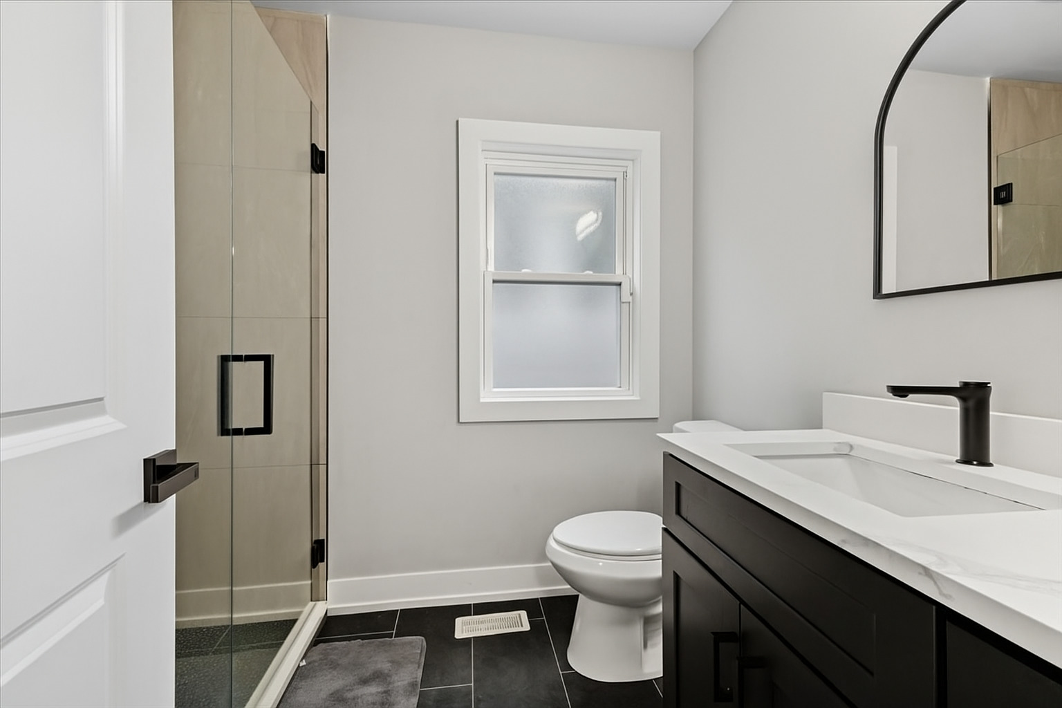 8404 South Carpenter Street Chicago, IL 60620 - Photo 7 of 21 a bathroom with a sink a toilet and mirror