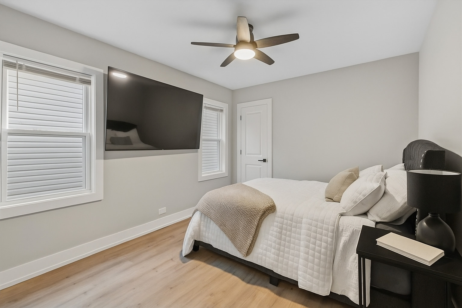 8404 South Carpenter Street Chicago, IL 60620 - Photo 8 of 21 a bedroom with a bed and a flat screen tv