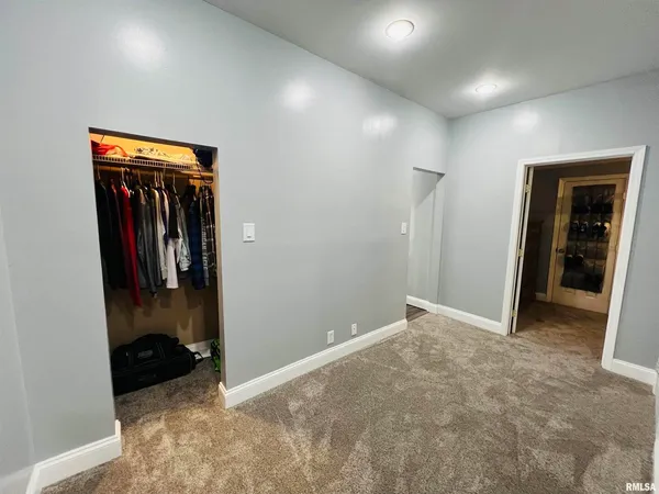 a view of a water heater and a stove in a room