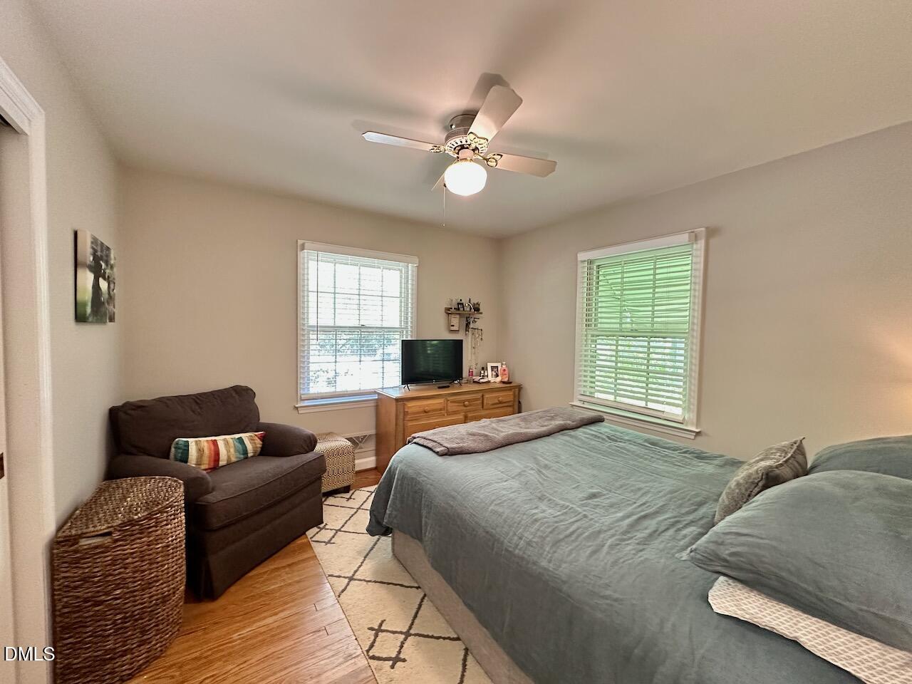 2813 Barmettler Street Raleigh, NC 27607 - Photo 11 of 22 a bedroom with a bed couch and a window