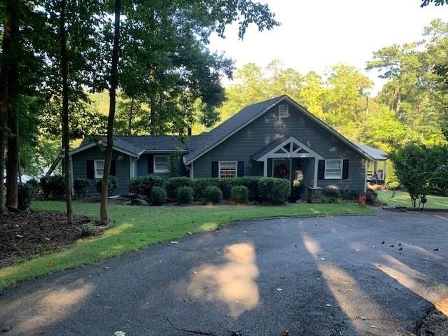 142 Blackberry Road Jackson, GA 30233 - Photo 1 of 1 a front view of a house with a yard and garage