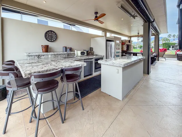 a kitchen with a table and chairs in it
