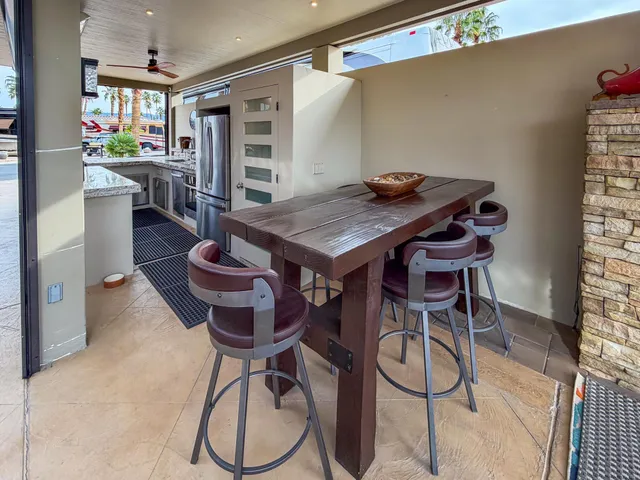 a dinning table and chairs in a room