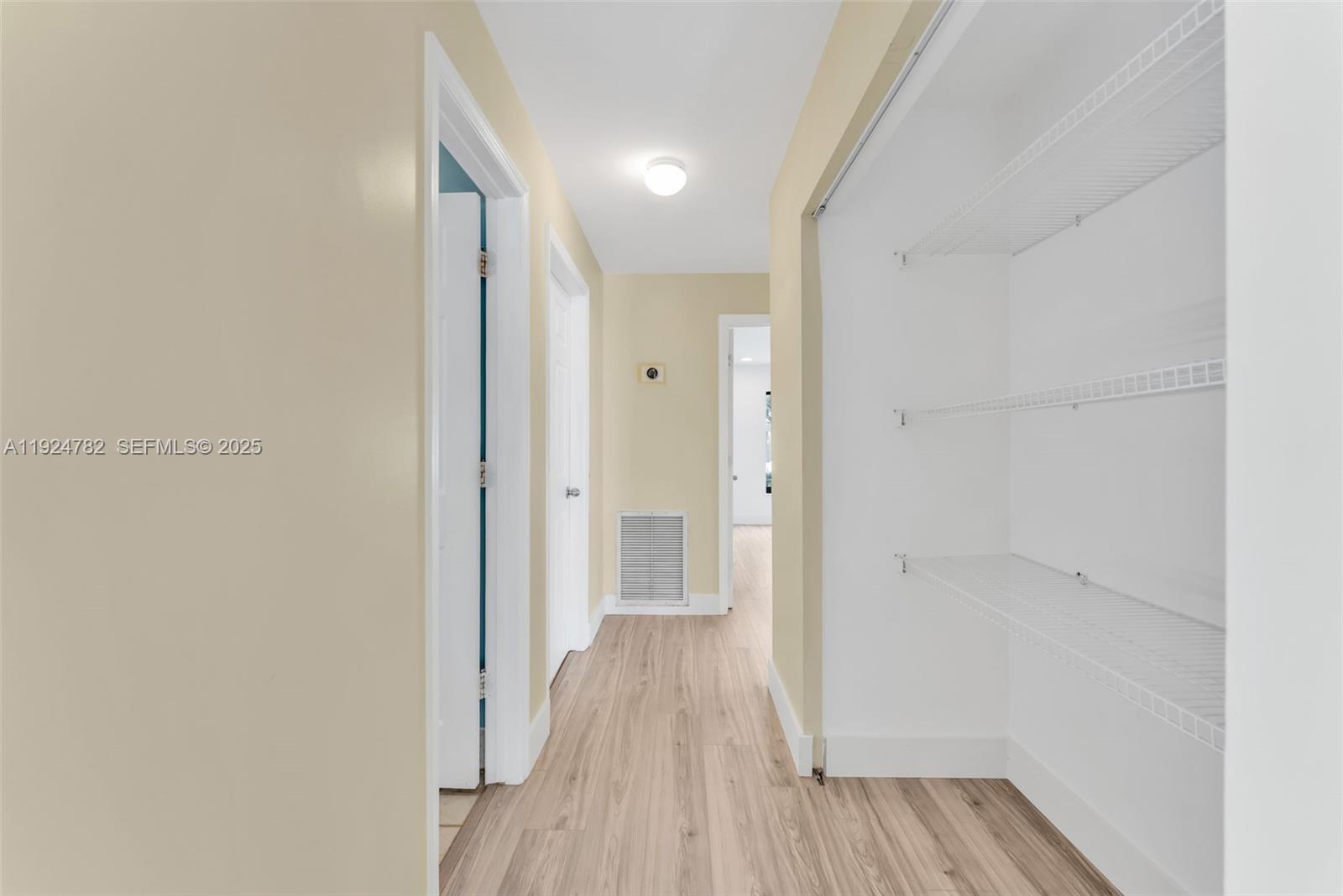 11525 Southwest 135th Court Miami, FL 33186 - Photo 18 of 42 a view of a hallway with wooden floor