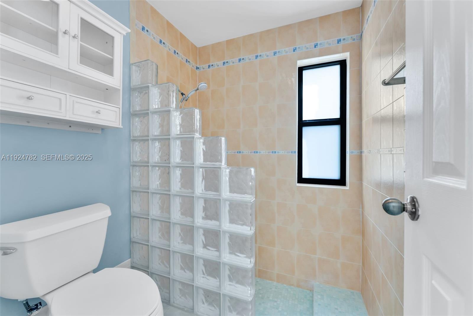 11525 Southwest 135th Court Miami, FL 33186 - Photo 23 of 42 a bathroom with a toilet and a shower