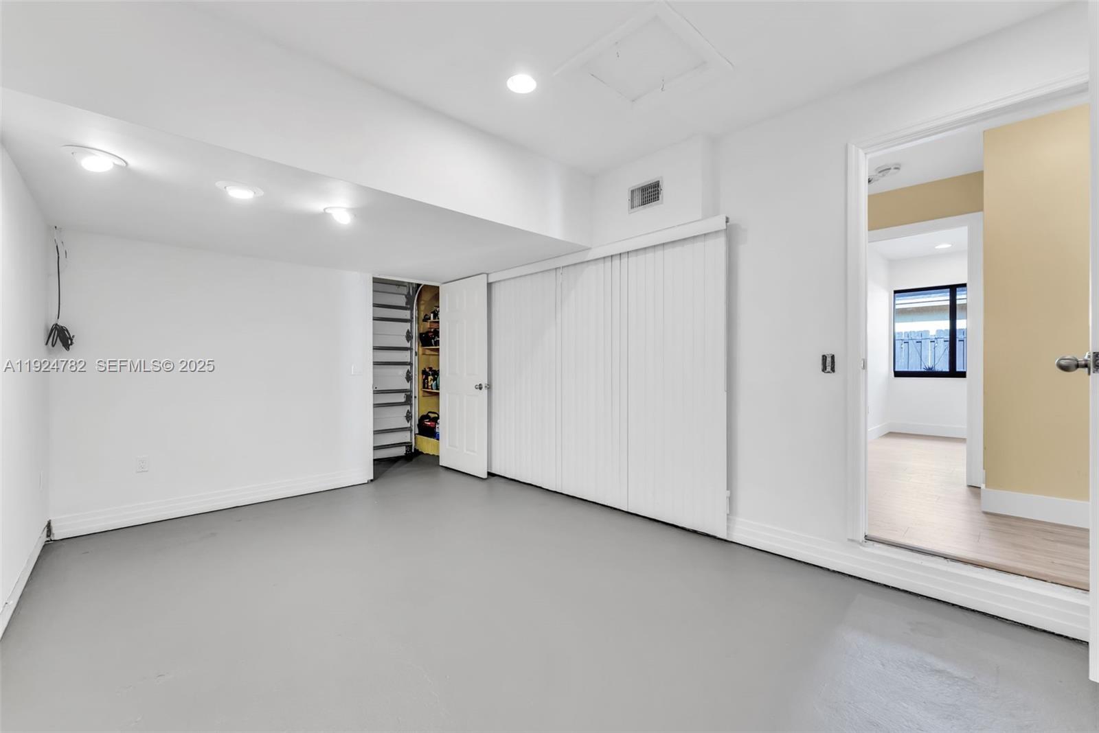 11525 Southwest 135th Court Miami, FL 33186 - Photo 28 of 42 an empty room with a empty space and windows