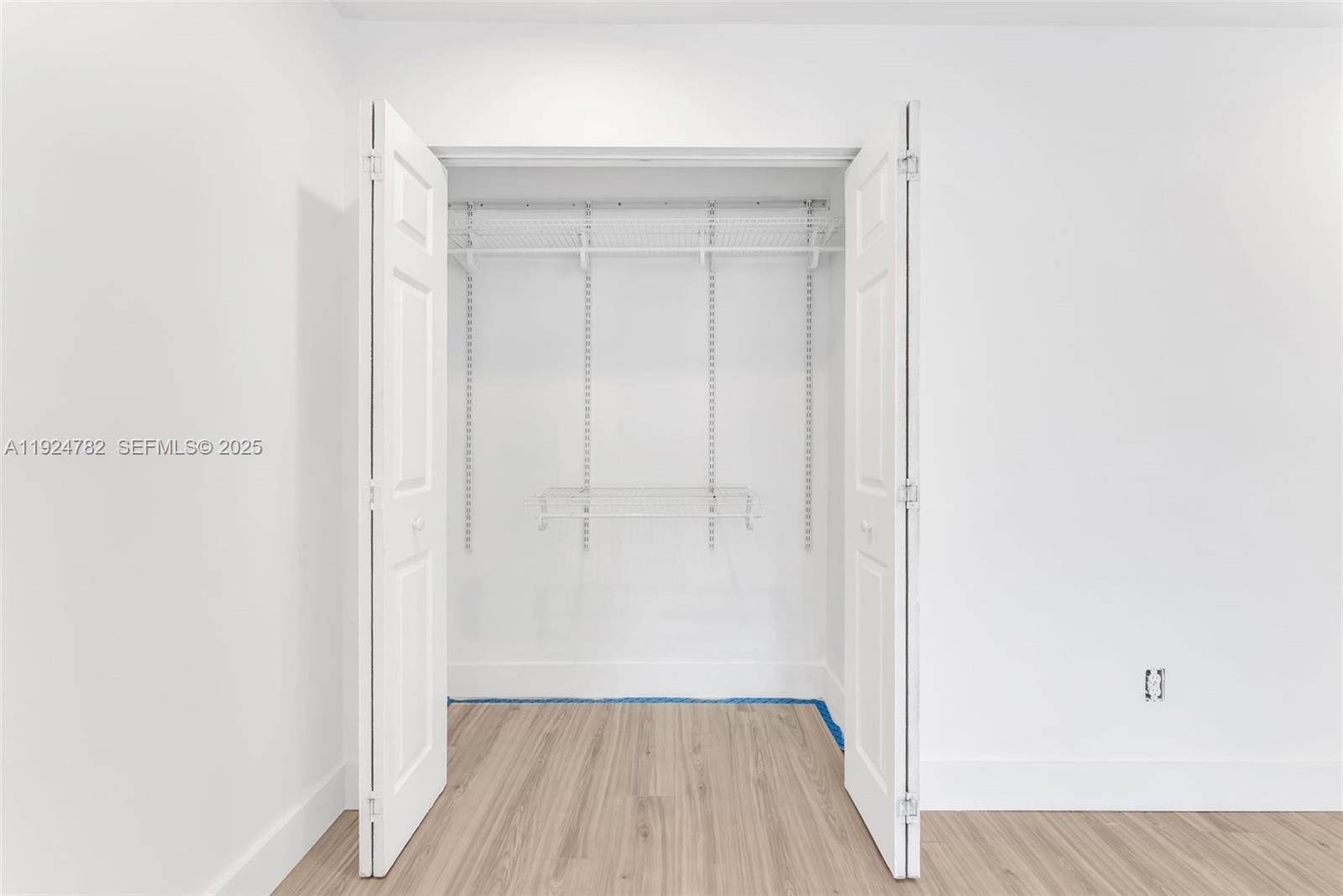 11525 Southwest 135th Court Miami, FL 33186 - Photo 29 of 42 a view of a room with wooden floor