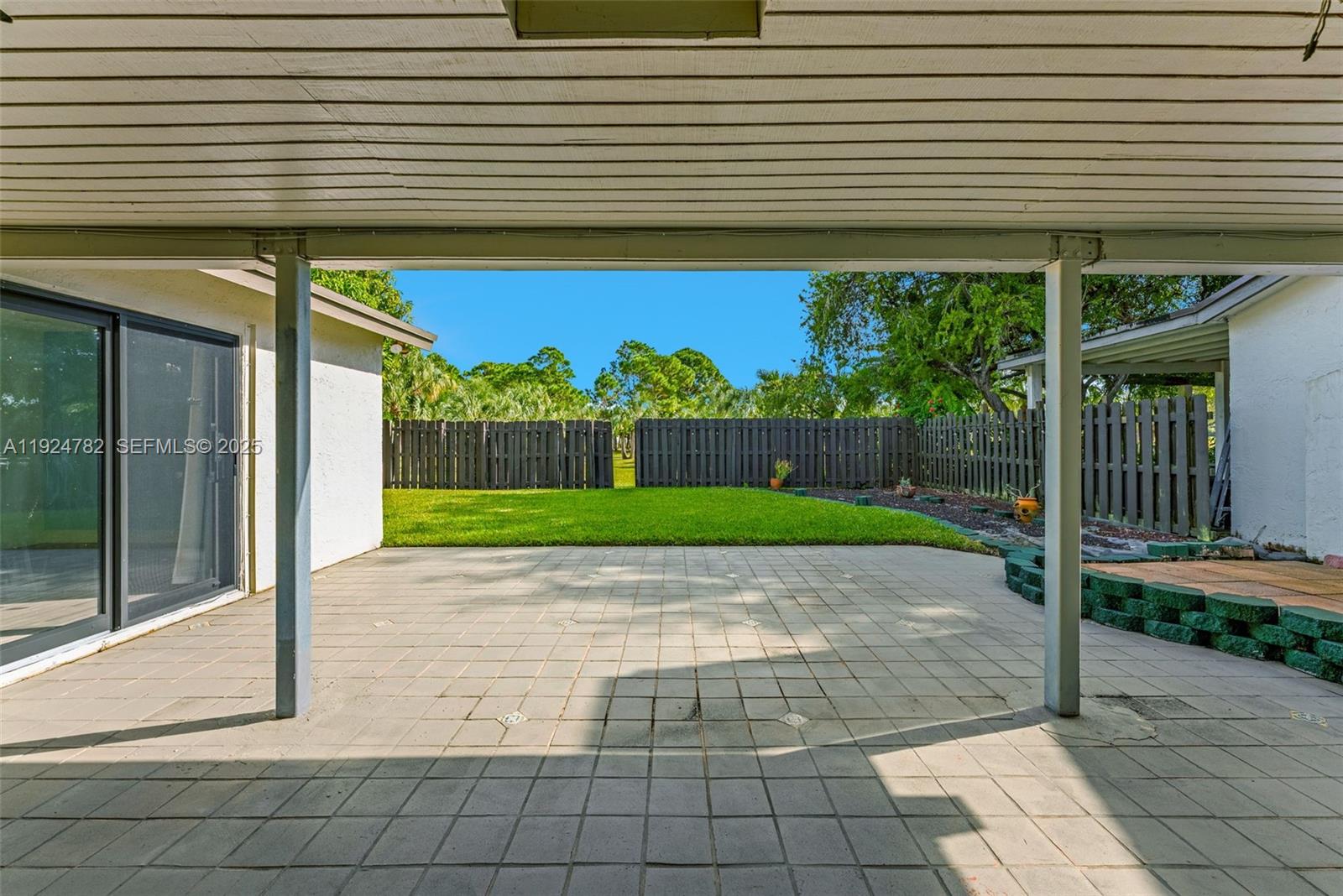 11525 Southwest 135th Court Miami, FL 33186 - Photo 31 of 42 a view of a house with a backyard