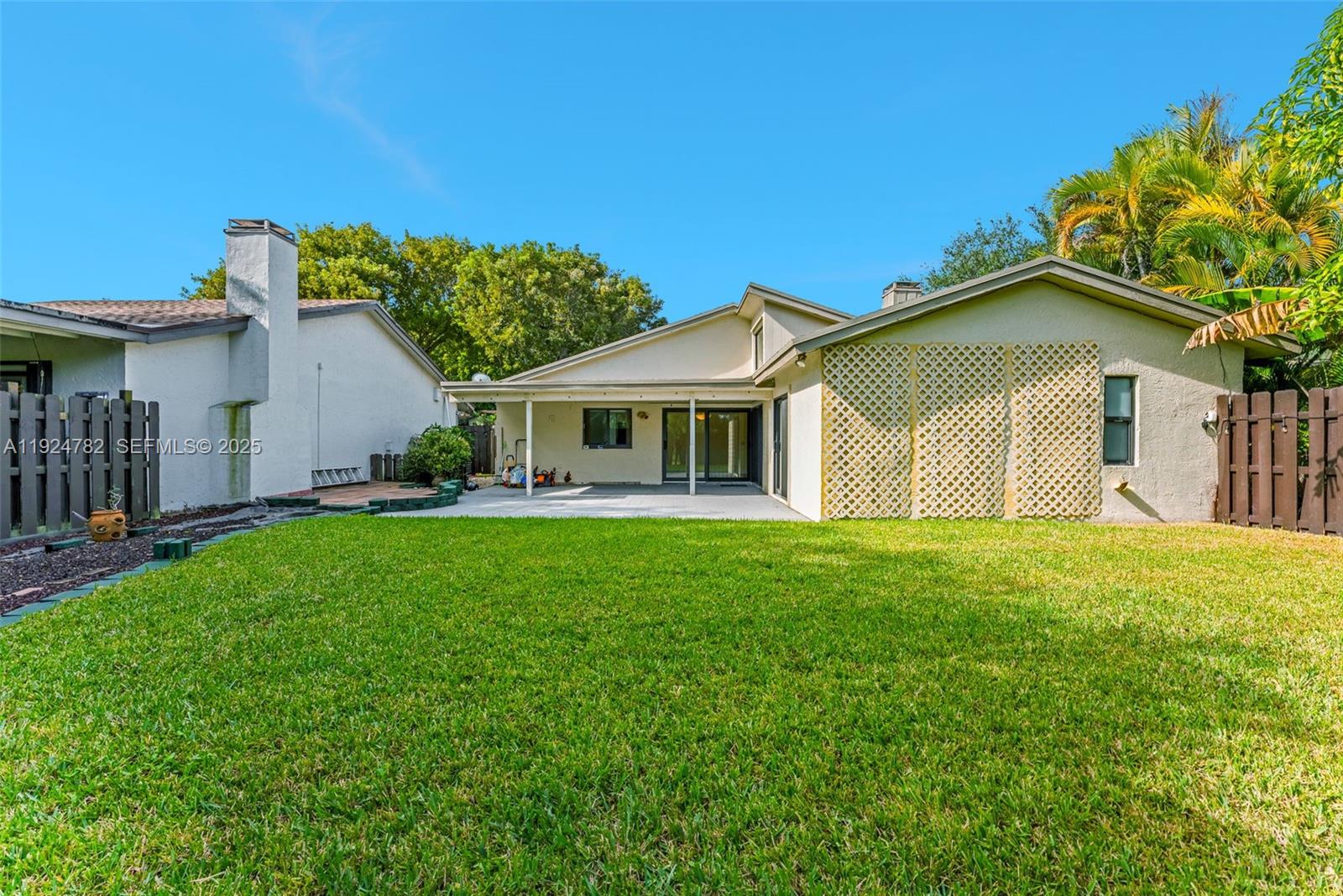 11525 Southwest 135th Court Miami, FL 33186 - Photo 34 of 42 a front view of a house with a garden