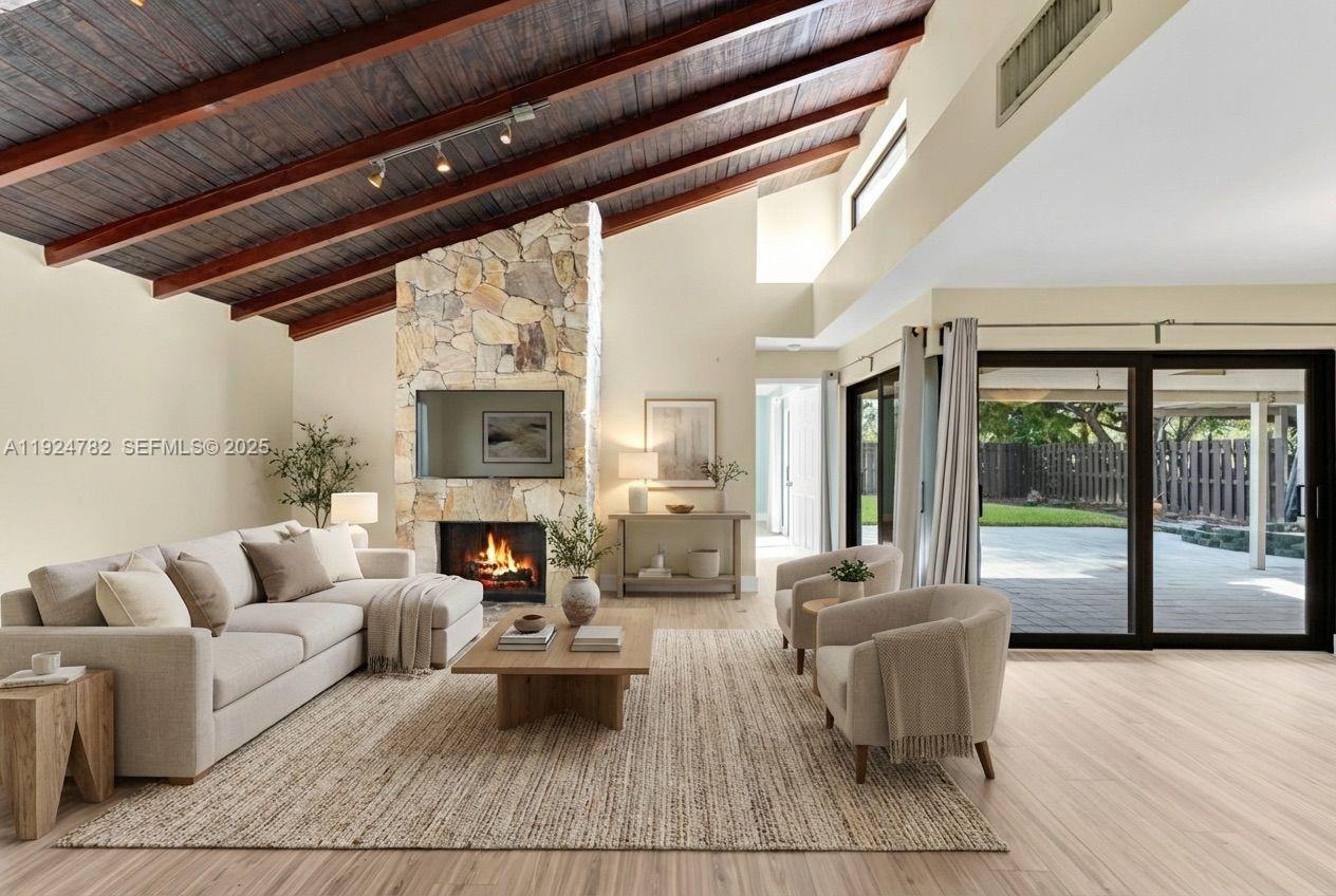 11525 Southwest 135th Court Miami, FL 33186 - Photo 7 of 42 a living room with furniture fireplace and flat screen tv
