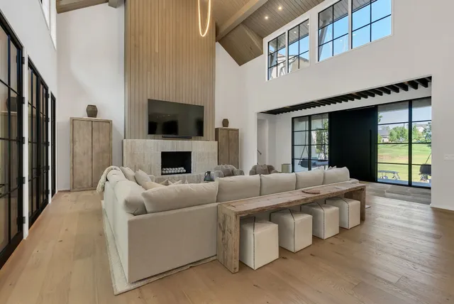 a large kitchen with kitchen island a sink counter and chairs