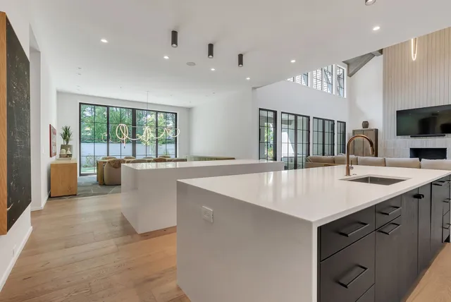 a bathroom with a granite countertop sink a toilet and shower