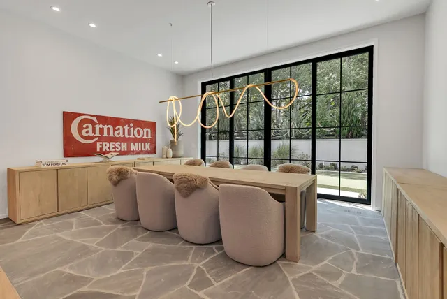 a bedroom with a bed and lamp next to a window