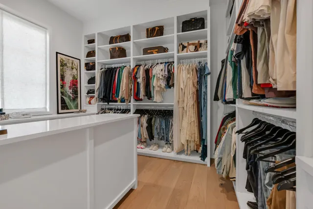 a living room with furniture and a ceiling fan