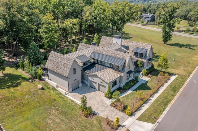a living room with furniture fireplace and flat screen tv