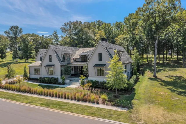 a living room with couches and a flat screen tv