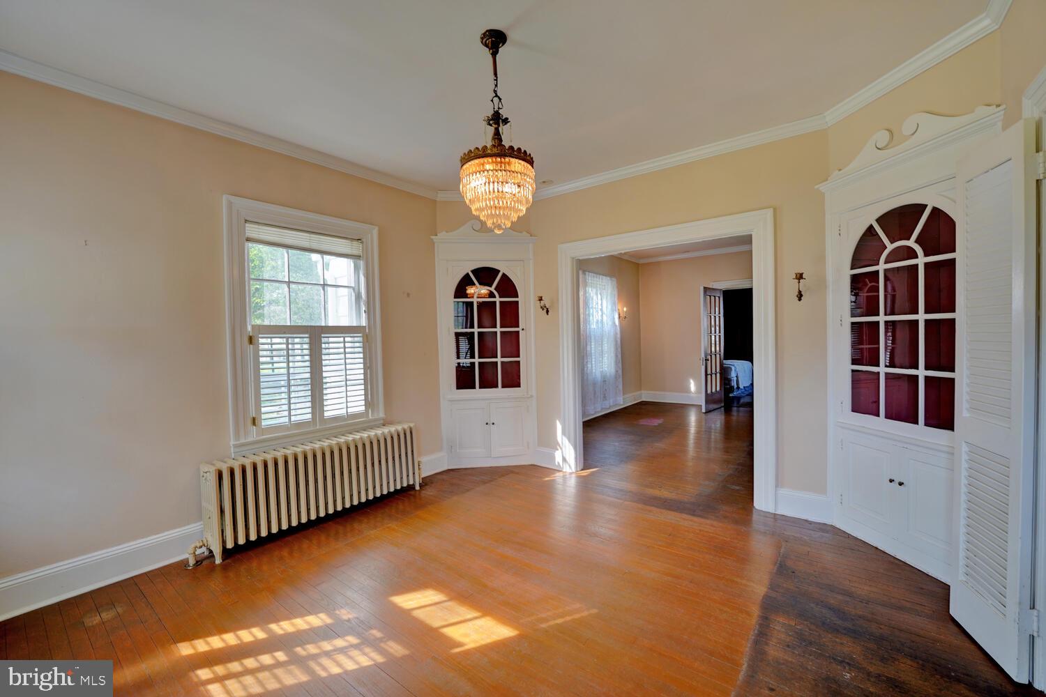 21 Hazel Road Dover, DE 19901 - Photo 24 of 69 a view of an empty room with a window and wooden floor