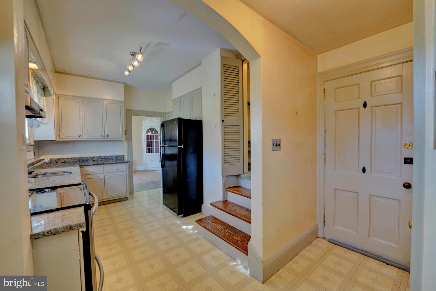 21 Hazel Road Dover, DE 19901 - Photo 31 of 69 a kitchen with stainless steel appliances granite countertop a refrigerator and a stove top oven