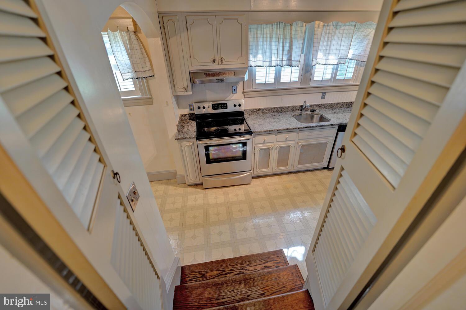 21 Hazel Road Dover, DE 19901 - Photo 32 of 69 a kitchen with a stove a sink and a window