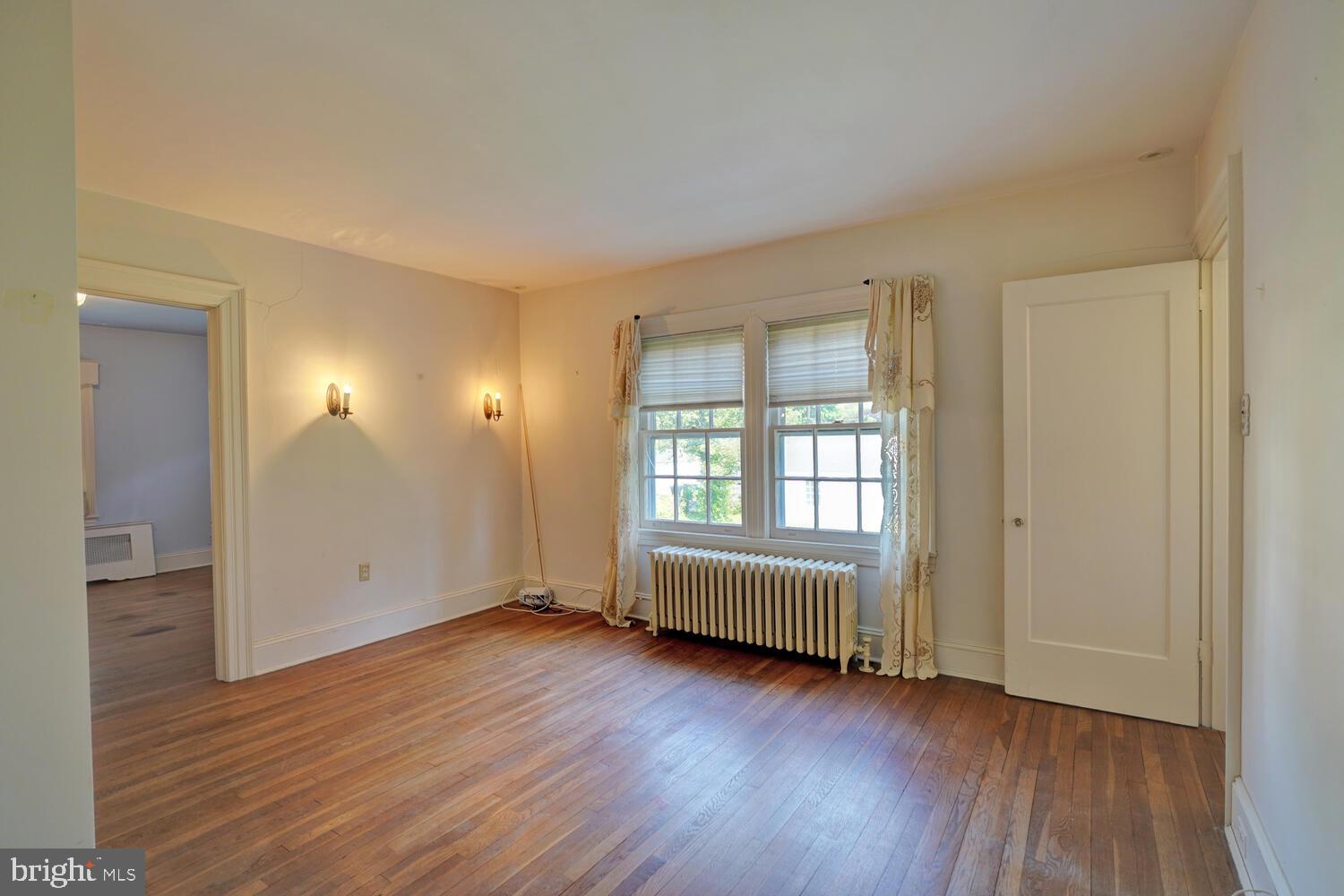 21 Hazel Road Dover, DE 19901 - Photo 40 of 69 an empty room with wooden floor and windows