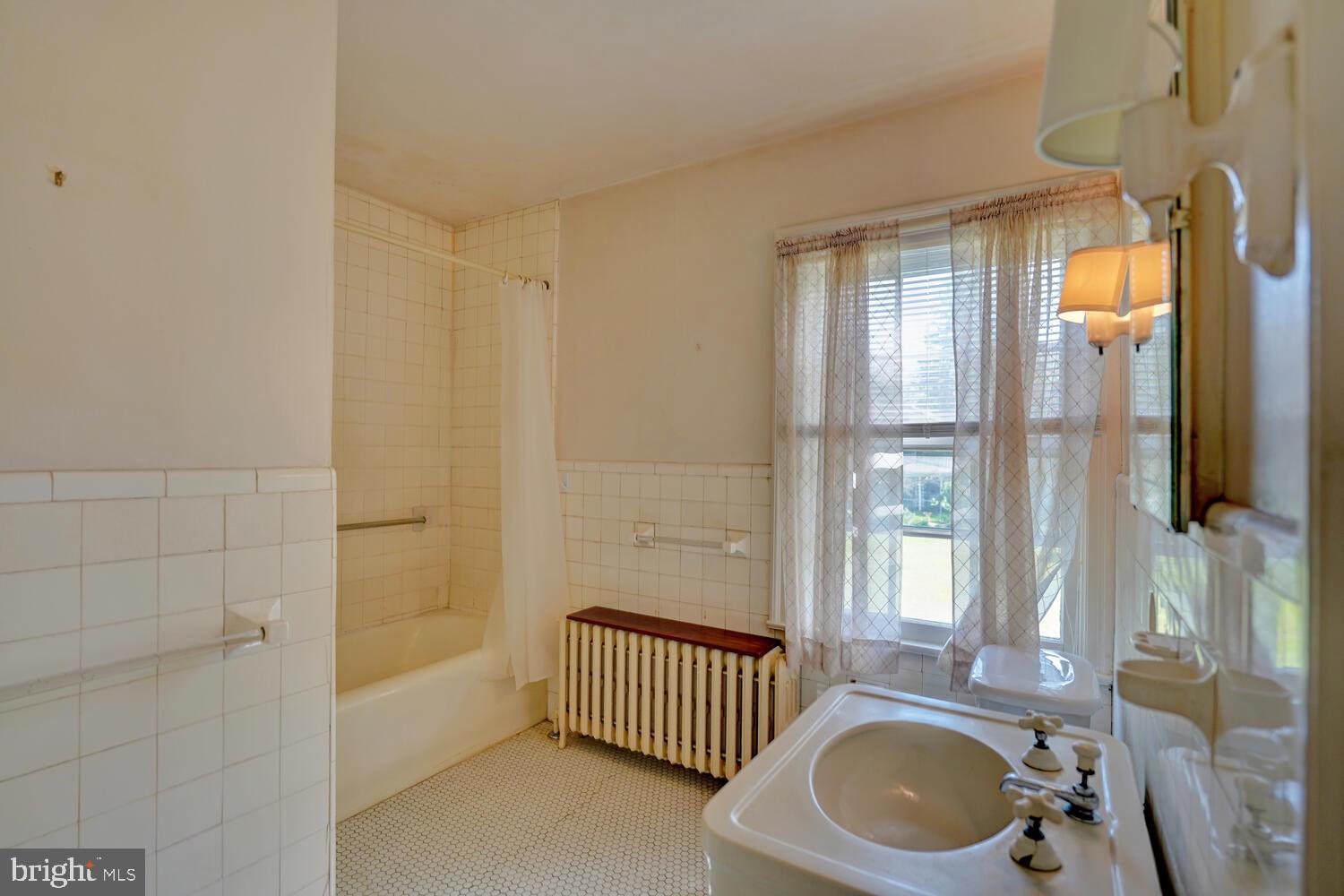 21 Hazel Road Dover, DE 19901 - Photo 48 of 69 a bathroom with a sink a bathtub and shower